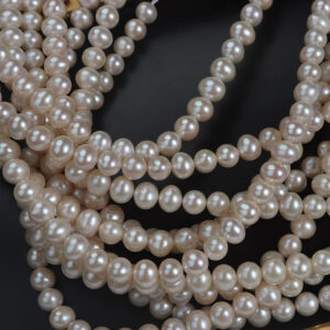 Perlas de agua dulce Keshi ovaladas color champán de 8,5-9 mm