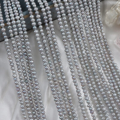 3-4 mm große, bestrahlte, grau gefärbte, ovale Süßwasserperlen