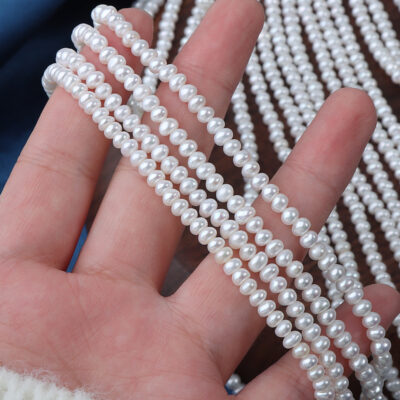 3-4 mm weiße, glatte, knopfförmige Süßwasserperlen