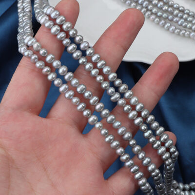 Perlas de agua dulce ovaladas irradiadas de color gris teñido de 4 mm