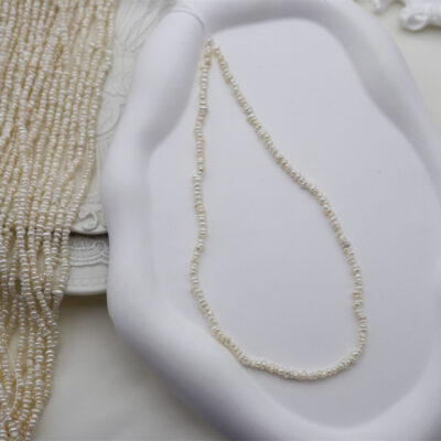 3-4 mm Mini-Wildperlen mit flacher Rückseite aus Süßwasser