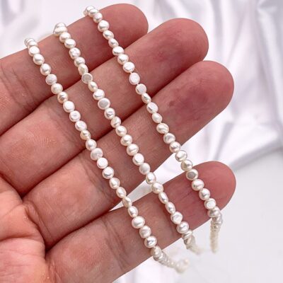 Perlas barrocas premium de 3 mm con perforación lateral y brillo de doble cara