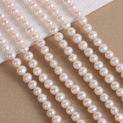 Perlas de agua dulce ovaladas naturales premium de 7-8 mm con ligeras imperfecciones