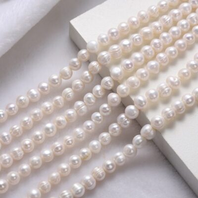 Perlas de agua dulce ovaladas enhebradas naturales de 8-11 mm