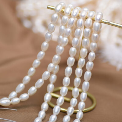 Perles d'eau douce blanches de riz à surface lisse de 5 à 6 mm