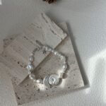 Ensemble collier de perles baroques avec pendentif disque rond