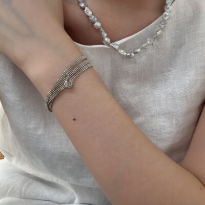 Expositor lateral de collar de perlas pepita barrocas azules