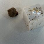 Flaschenförmige Perlenohrstecker-Show