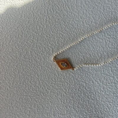 Collier de perles œil-grec avec pendentif en argent plaqué or