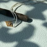 Collier de perles œil-de-grec avec pendentif en argent plaqué or