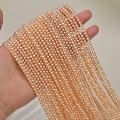 Perles d'eau douce de 3 à 4 mm, couleur champagne, lustrées, presque sans défaut, en rang.