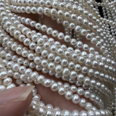 4-5mm White Aurora Spiral Oval Freshwater Pearls