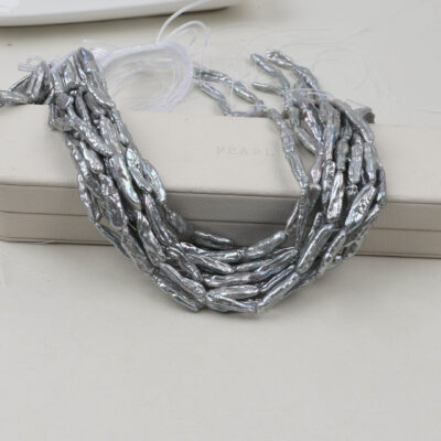 Perles d'eau douce Biwa grises teintées de 7 x 22 mm