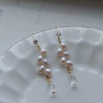 Detalles de los pendientes de cristal blanco de agua dulce con forma de gota de trigo