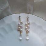 Pendientes colgantes de cristal blanco de agua dulce natural con forma de espiga.